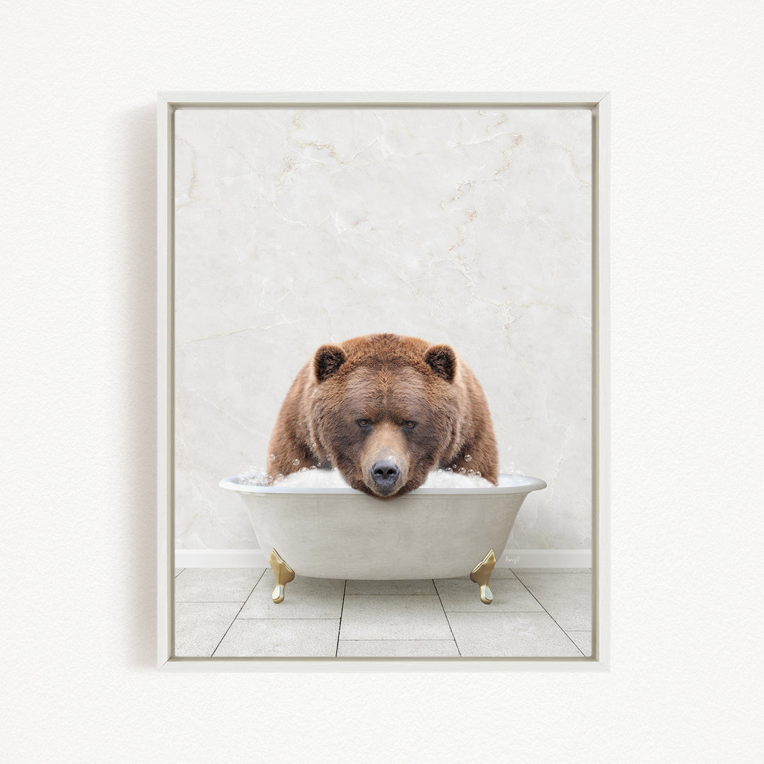 A brown bear is sitting in a white bathtub filled with water, appearing to be enjoying a relaxing bath.