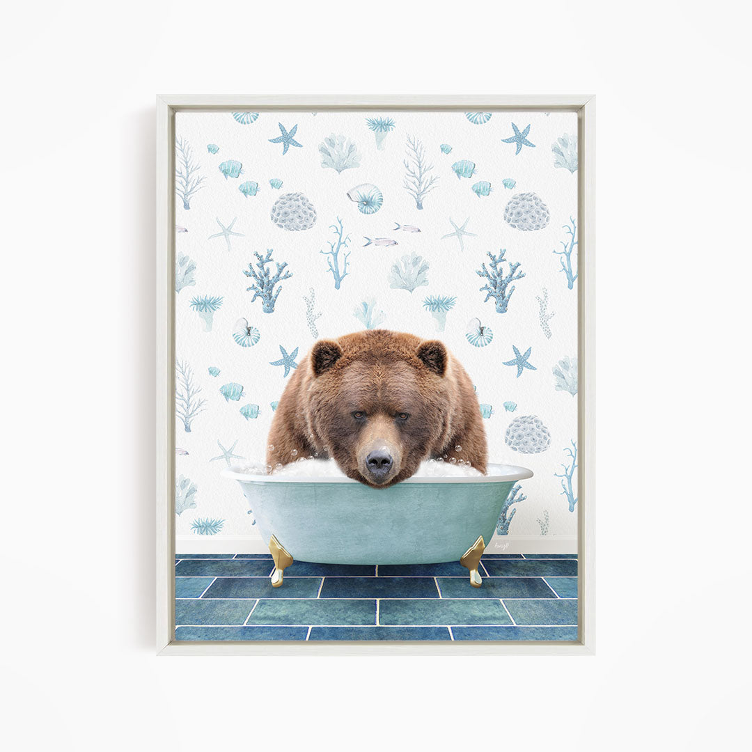 A brown bear is sitting in a blue bathtub, surrounded by a pattern of seashells, starfish, and other marine life.