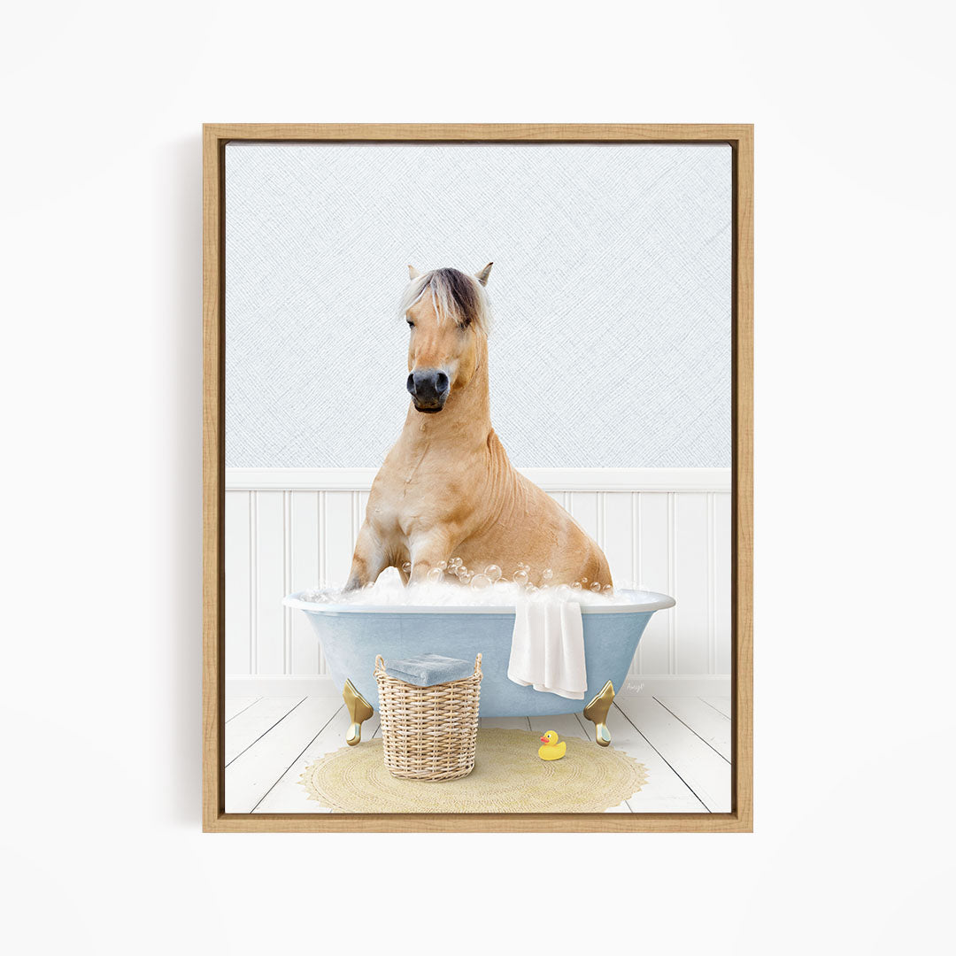 A light brown horse is sitting in a blue bathtub filled with water, surrounded by rubber ducks.