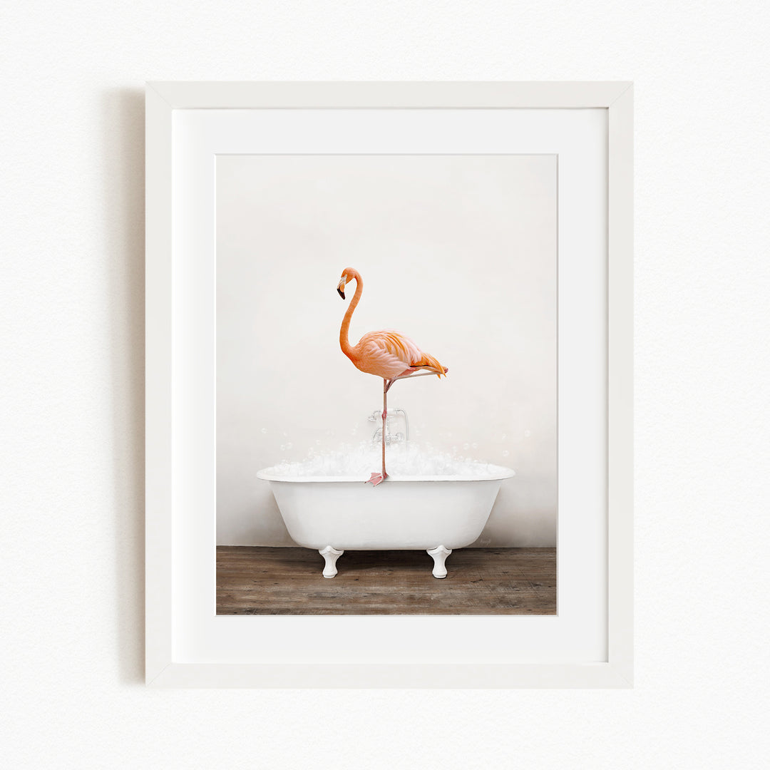A pink flamingo standing on one leg in a white bathtub filled with water.