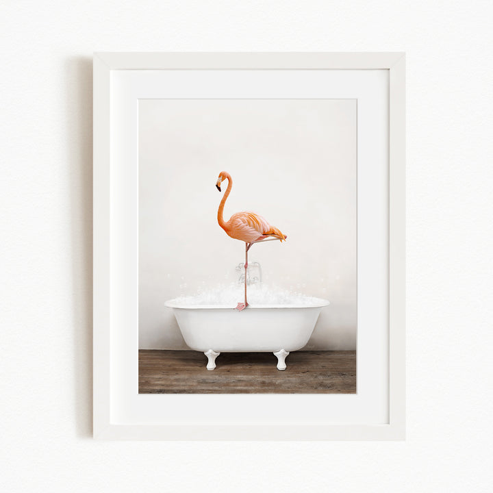 A pink flamingo standing on one leg in a white bathtub filled with water.