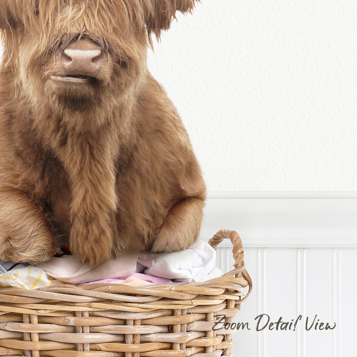A close-up image of a brown furry animal, possibly a dog or a yak, sitting in a wicker basket filled with clothes.