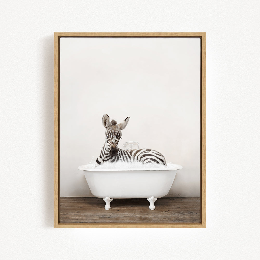 A zebra is sitting in a white bathtub, surrounded by bubbles, creating a whimsical and playful scene.