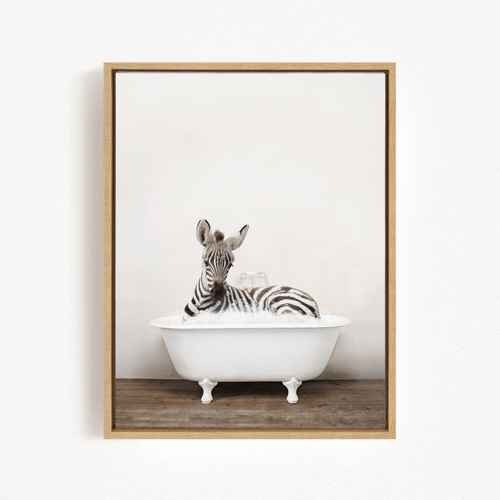 A zebra is sitting in a white bathtub, surrounded by bubbles, creating a whimsical and playful scene.