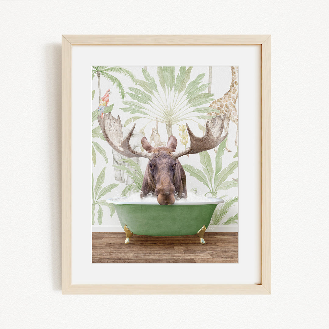 A moose with large antlers is sitting in a green bathtub, surrounded by a tropical wallpaper with palm trees and other animals.