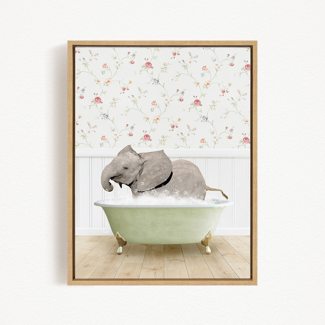 A gray elephant is sitting in a green bathtub filled with water, surrounded by a floral wallpaper.