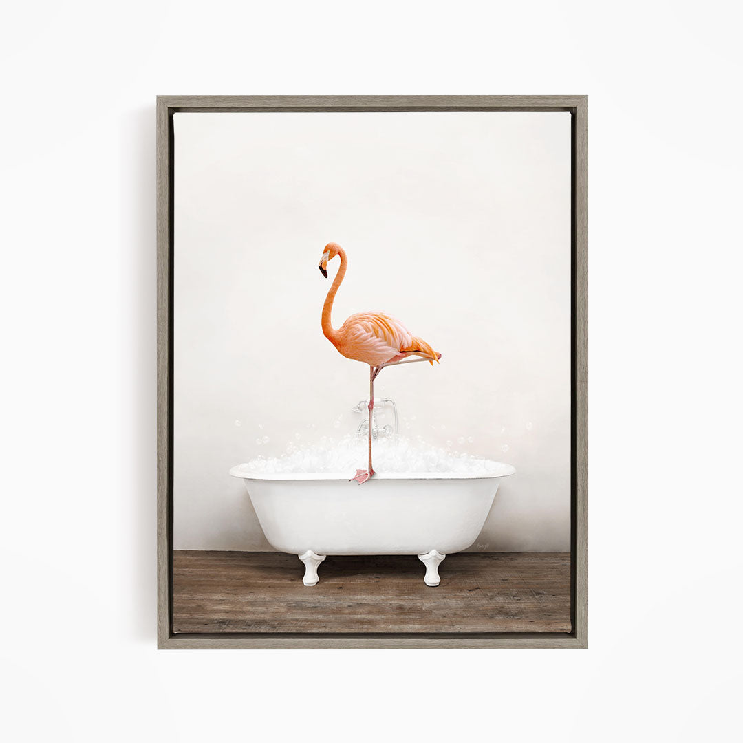 A vibrant flamingo stands on the edge of a white bathtub filled with water, creating a whimsical and playful scene.