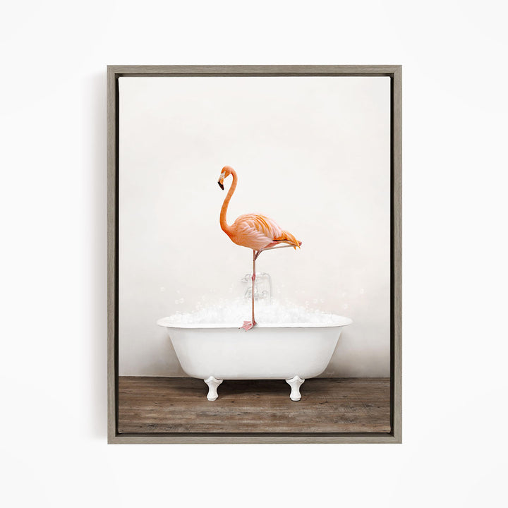 A vibrant flamingo stands on the edge of a white bathtub filled with water, creating a whimsical and playful scene.