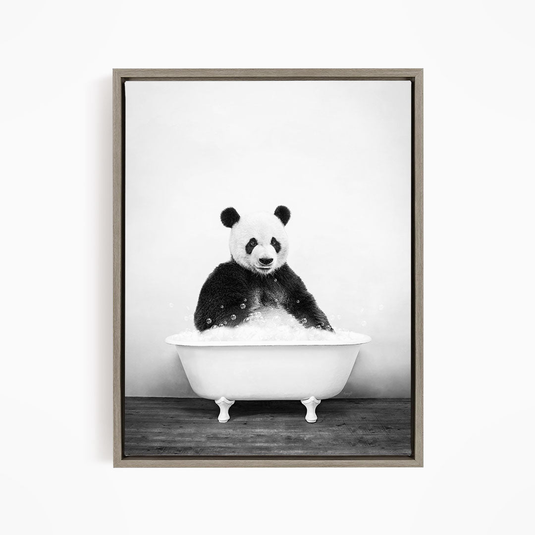 A panda bear sitting in a bathtub filled with bubbles, creating a whimsical and playful scene.