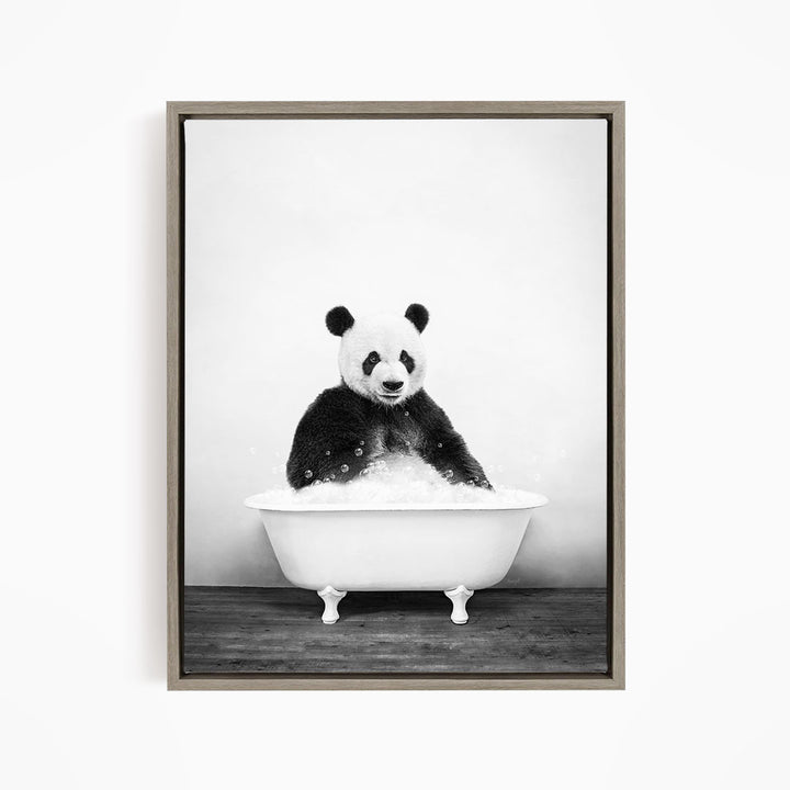 A panda bear sitting in a bathtub filled with bubbles, creating a whimsical and playful scene.