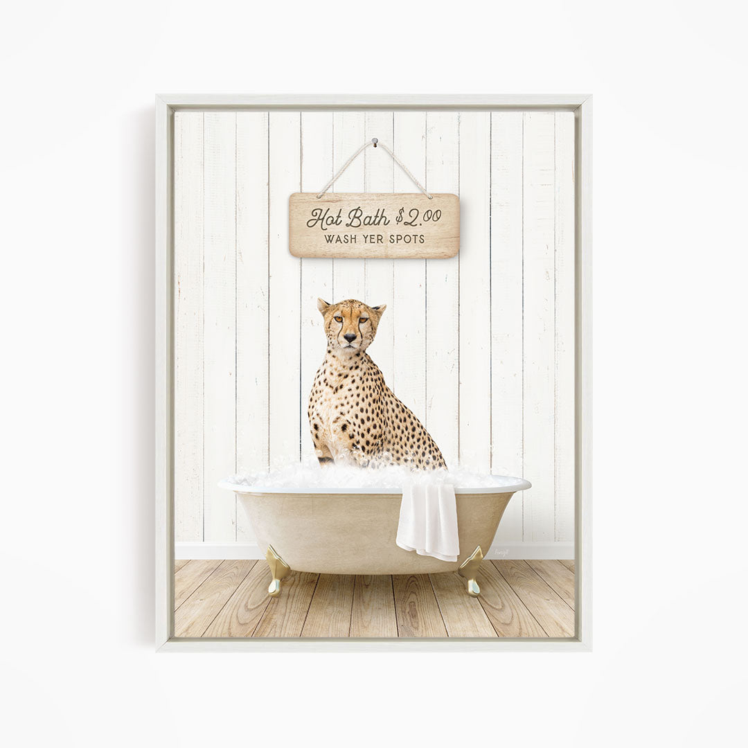 A cheetah sitting in a bathtub, with a sign above it that reads "Hot Bath $2.00 WASH YER SPOTS".