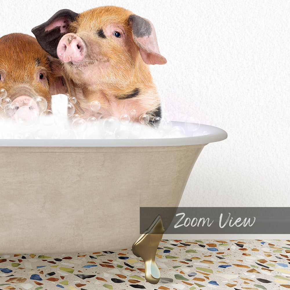 Two adorable pigs enjoying a bath in a white bathtub, surrounded by bubbles.