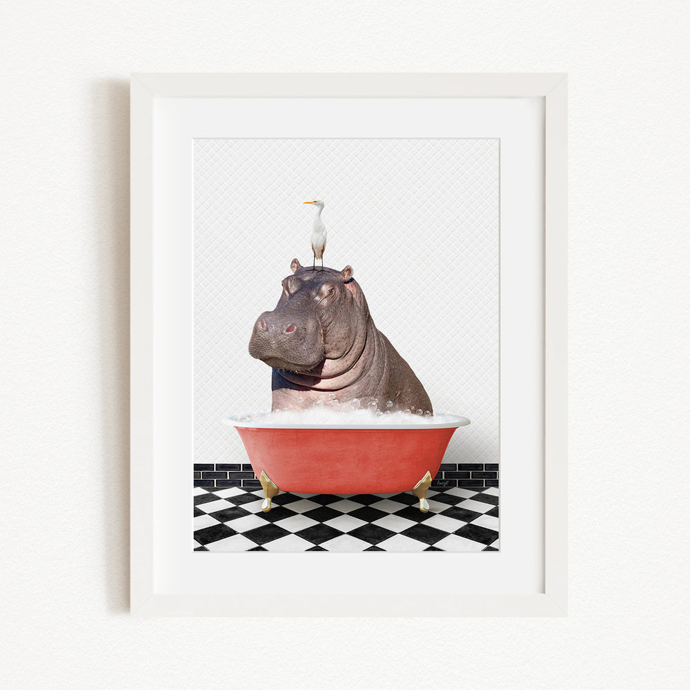 A framed image depicting a large, brown hippopotamus sitting in a red bathtub, with a seagull perched on its head.