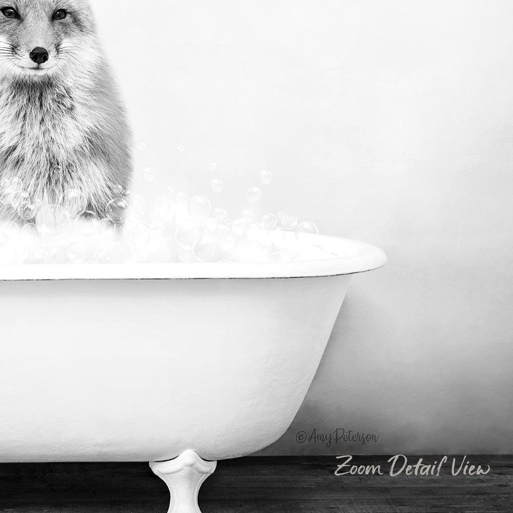 A black and white image of a fox standing in a bathtub filled with bubbles.