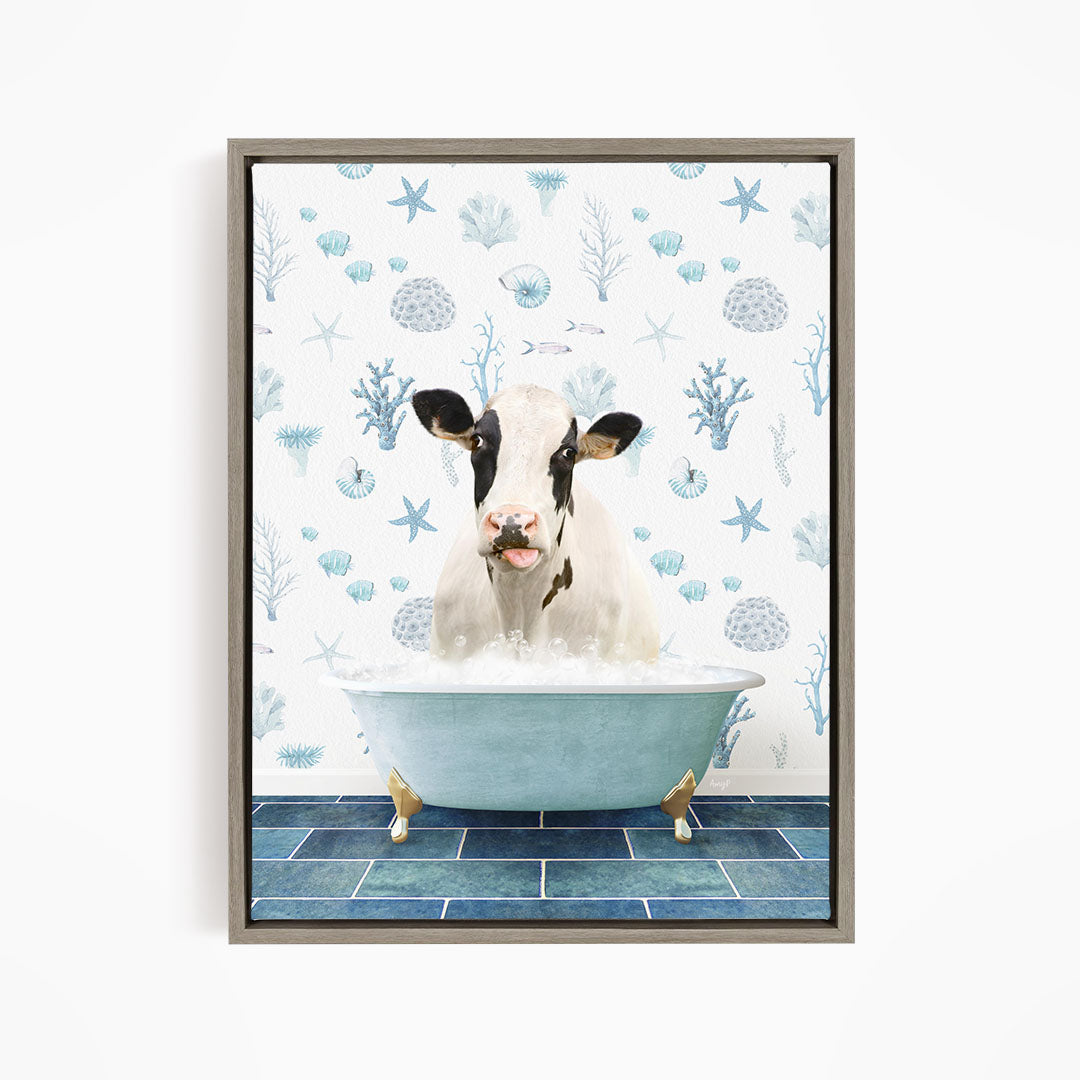 A cow is sitting in a bathtub filled with water, surrounded by blue and white seashells and starfish on the wall behind it.