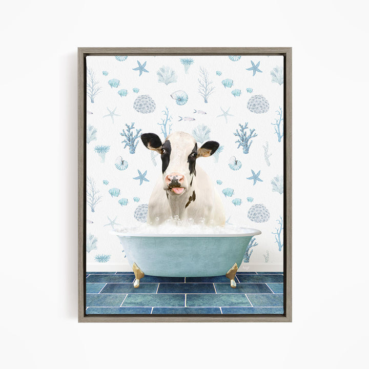 A cow is sitting in a bathtub filled with water, surrounded by blue and white seashells and starfish on the wall behind it.
