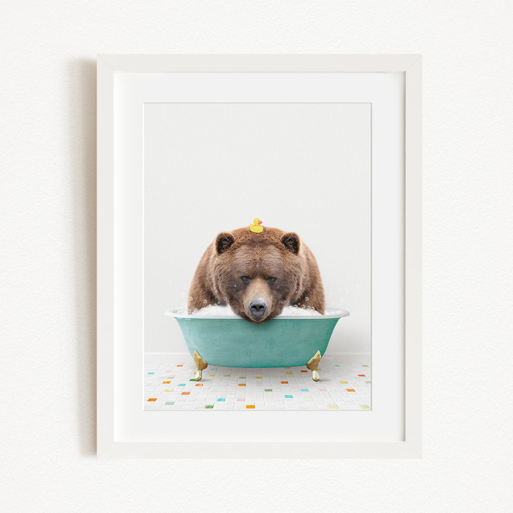 A brown bear is sitting in a green bathtub, surrounded by small yellow rubber ducks.