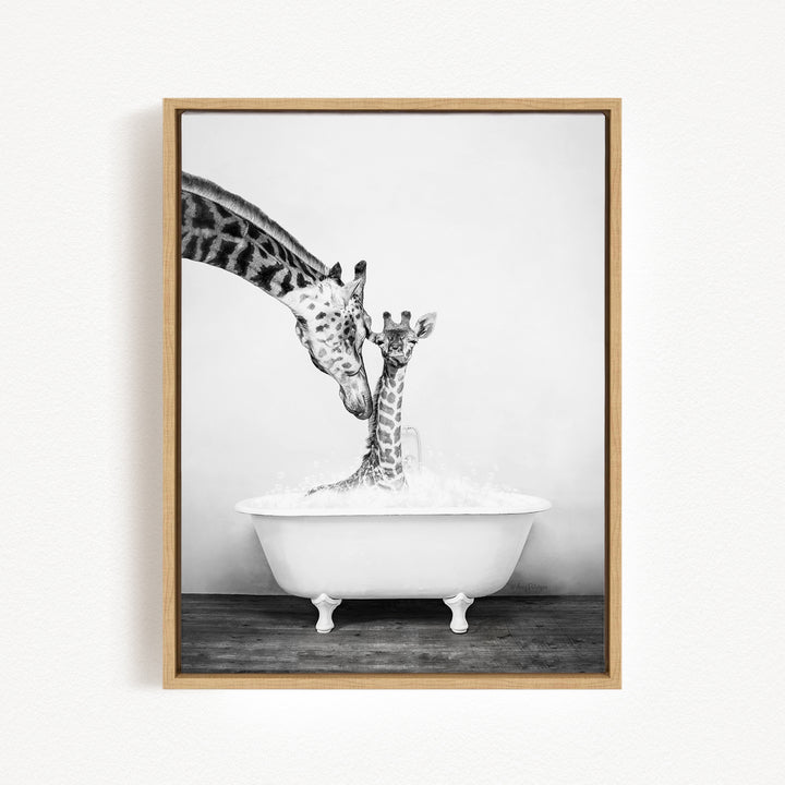 A mother giraffe and her baby giraffe enjoying a bath together in a white bathtub.