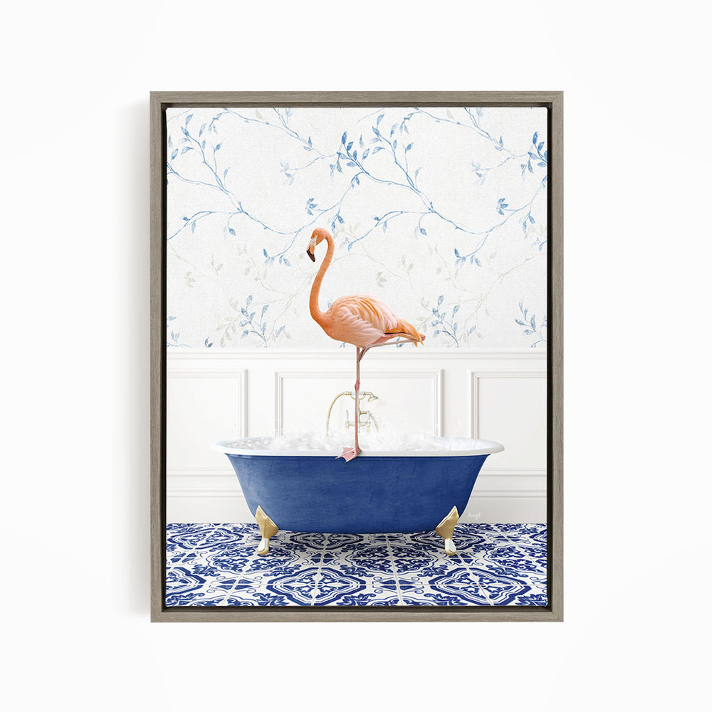 A pink flamingo stands on the edge of a blue bathtub, with a patterned tile floor and a floral wallpaper in the background.