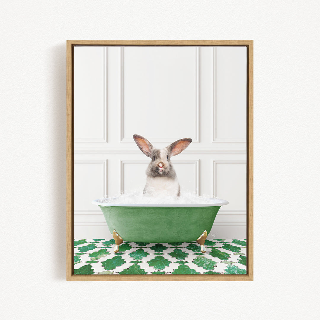 A white rabbit with brown ears is sitting in a green bathtub filled with water, looking directly at the camera.