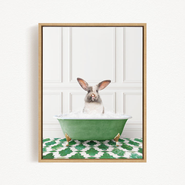 A white rabbit with brown ears is sitting in a green bathtub filled with water, looking directly at the camera.