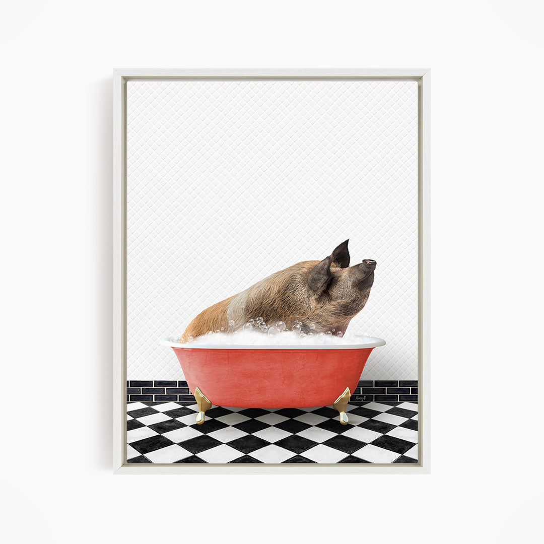 A brown pig sitting in a red bathtub filled with bubbles, looking up at the camera.