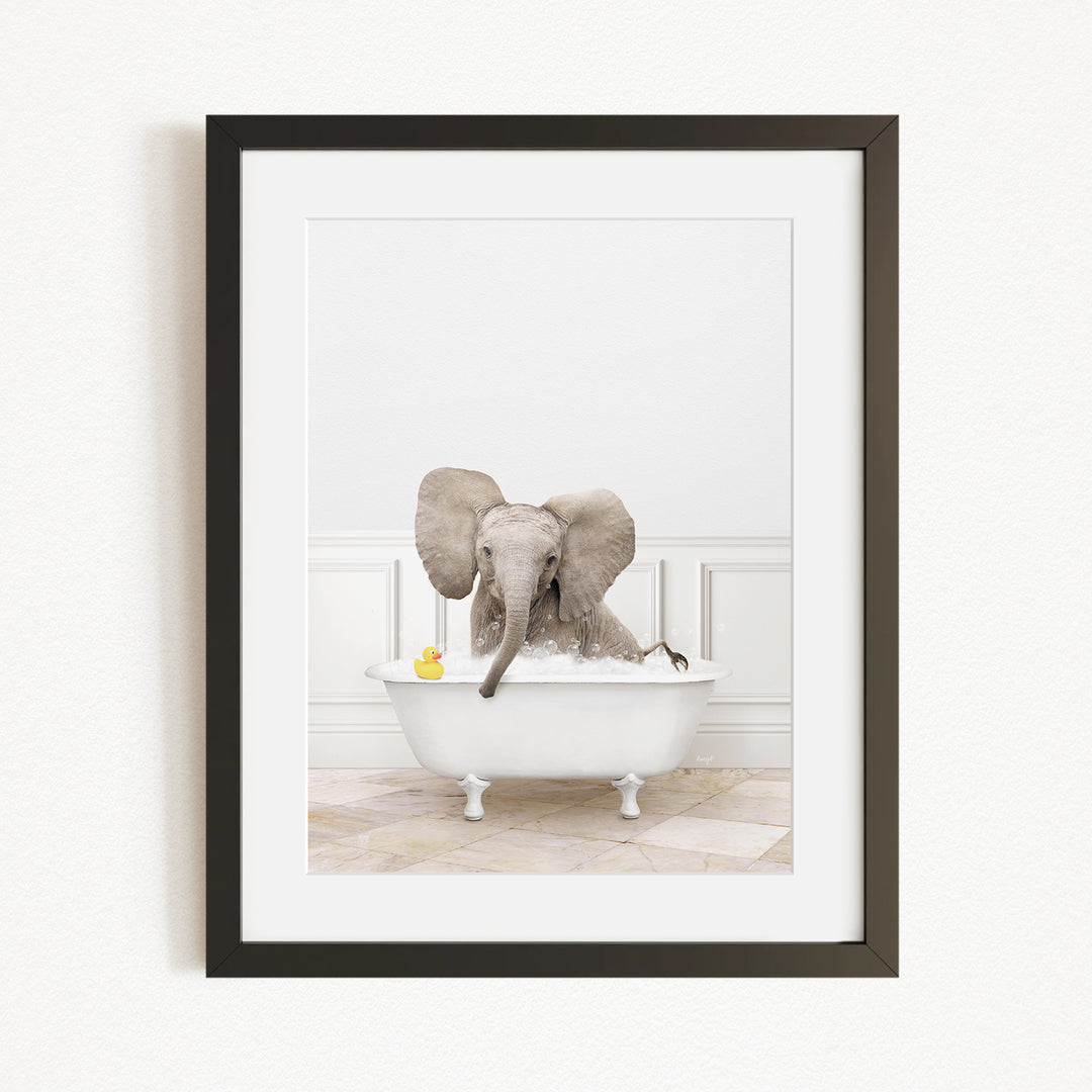 A baby elephant sitting in a white bathtub, surrounded by rubber ducks.