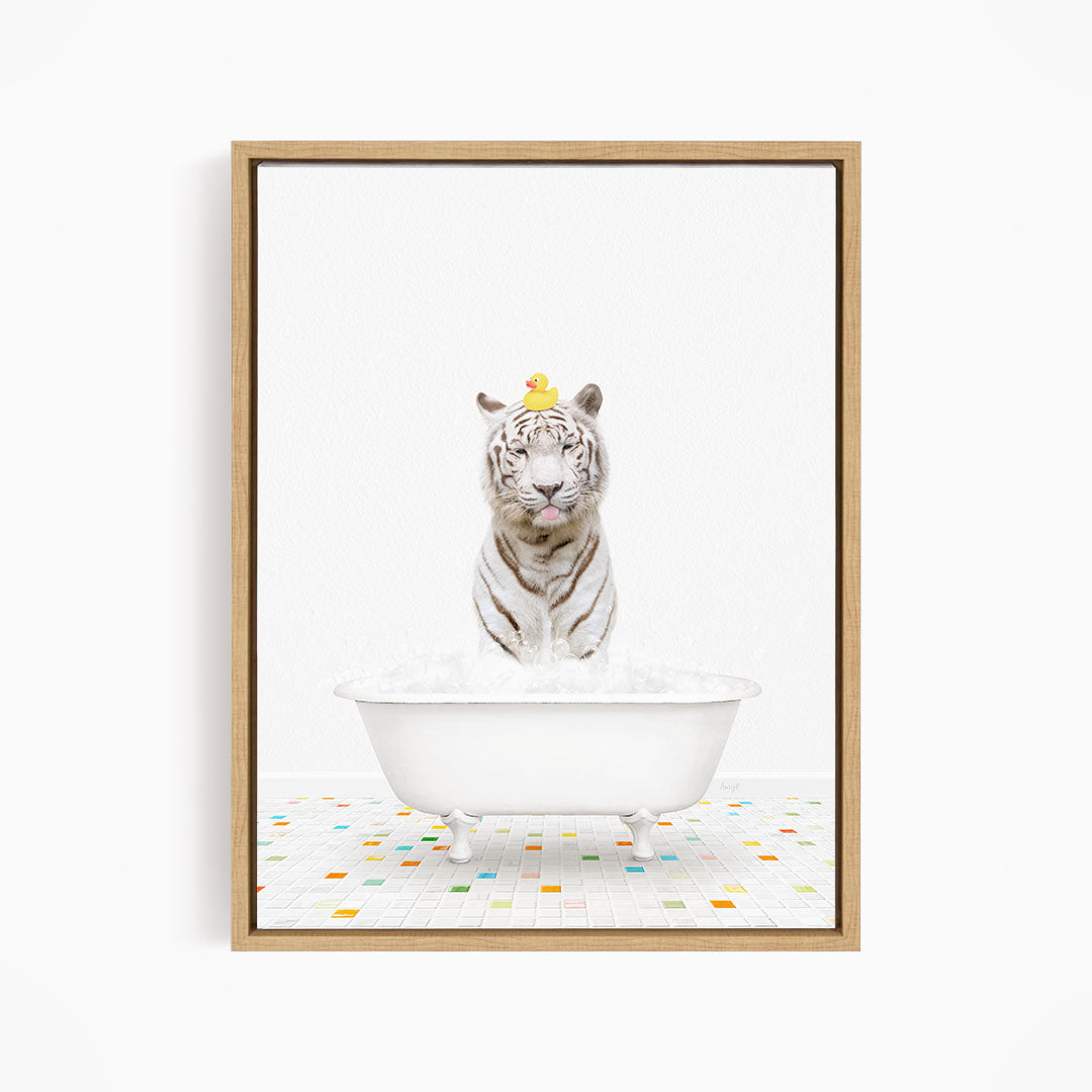 A white tiger is sitting in a white bathtub, with a yellow rubber duck perched on its head.