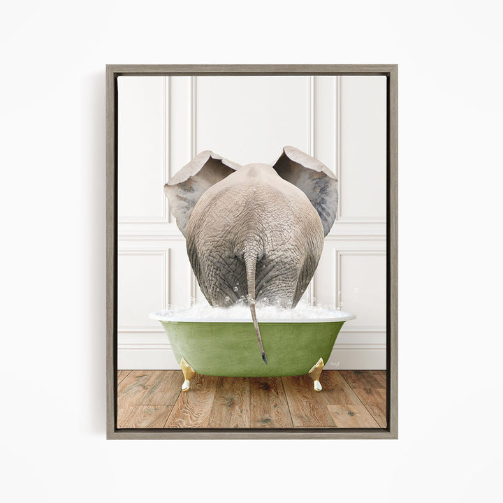 An elephant is standing in a green bathtub filled with water, with its trunk submerged in the water.