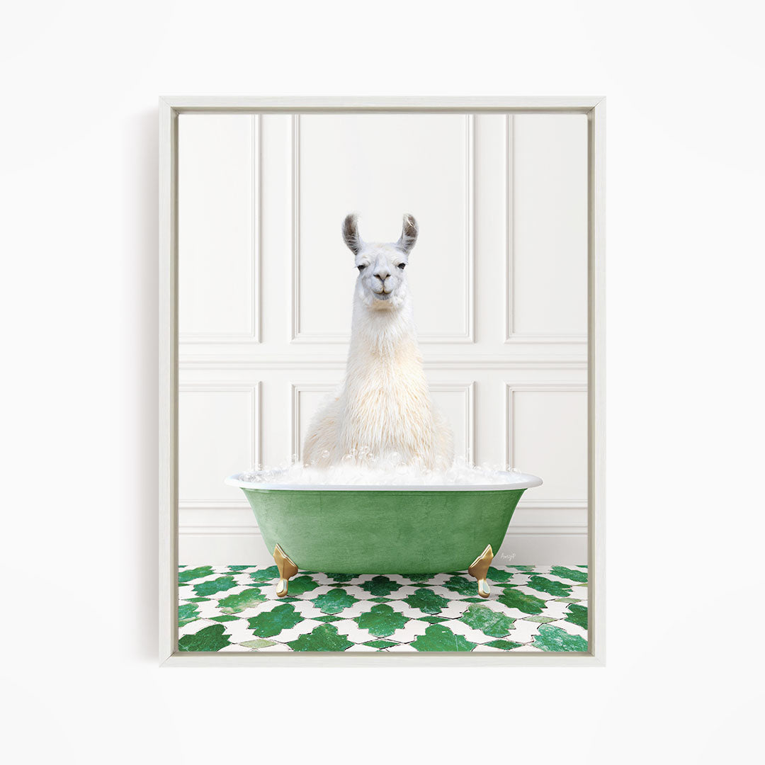 A white llama sitting in a green bathtub filled with bubbles, with a green and white patterned floor in the background.
