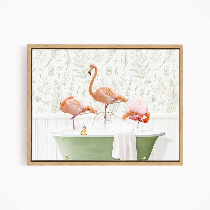 A framed image depicting three pink flamingos standing in a green bathtub filled with water, with a towel and a small toy duck floating on the surface.
