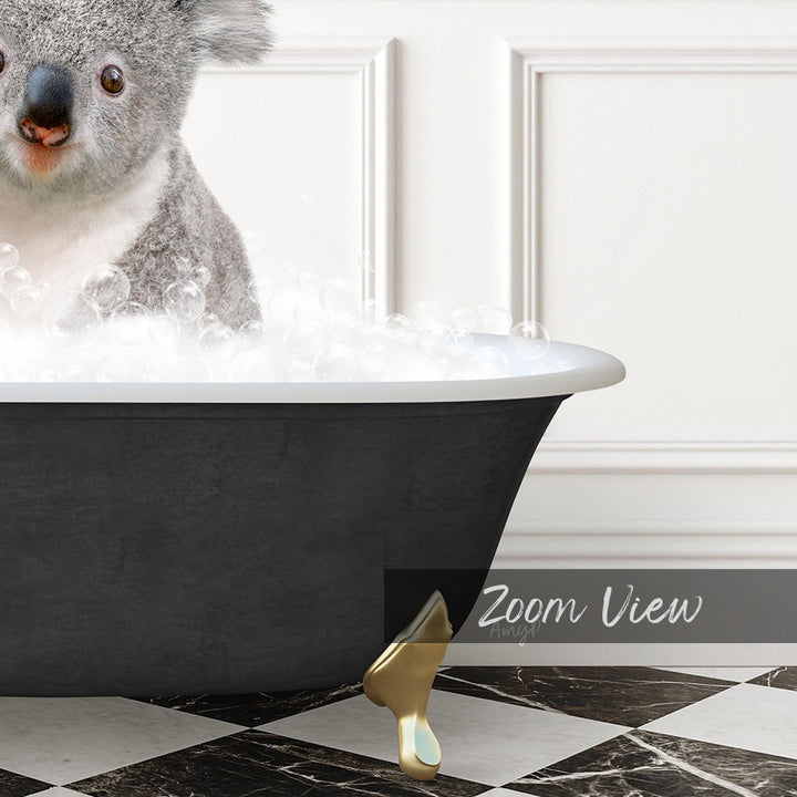 A koala sitting in a bathtub filled with bubbles, with a black and white checkered floor and a gold bathtub leg visible.