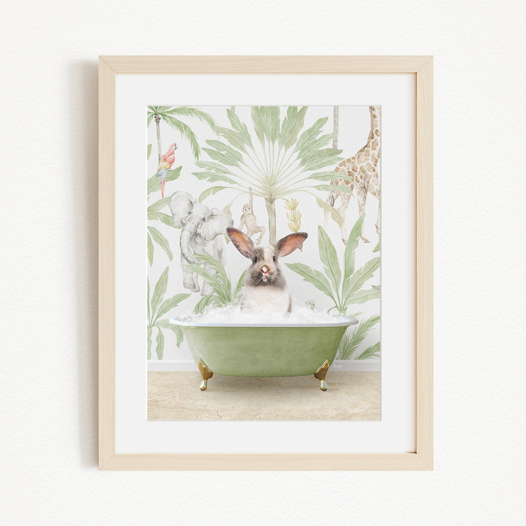 A framed print depicting a rabbit sitting in a green bathtub surrounded by various animals, including a giraffe, monkey, and elephant, against a tropical leafy background.