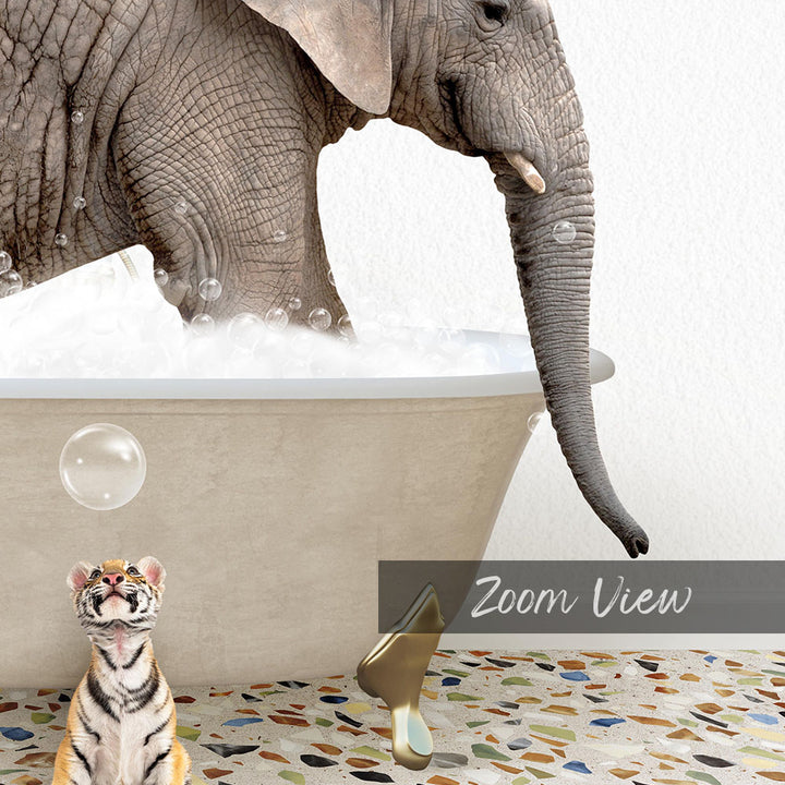 A large elephant is bathing in a tub filled with bubbles, while a small tiger figurine sits nearby.