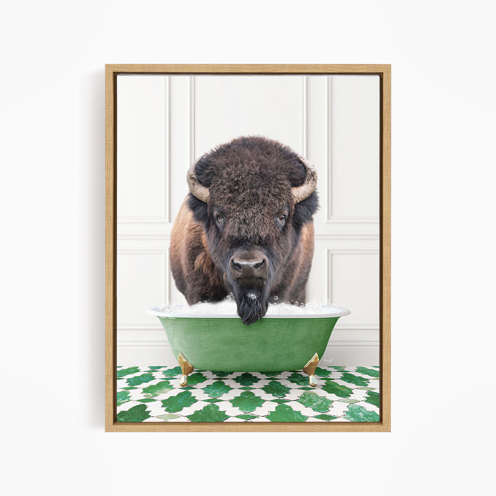 A buffalo with a long beard is standing in a green bathtub, with a patterned green and white rug on the floor beneath it.
