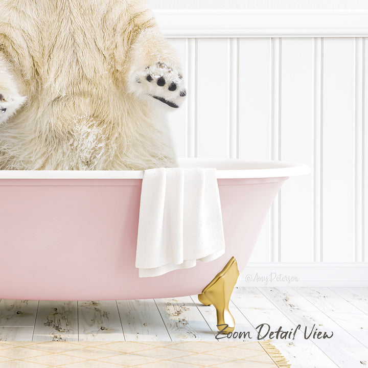 A polar bear is sitting in a pink bathtub, with its paws hanging out of the tub.