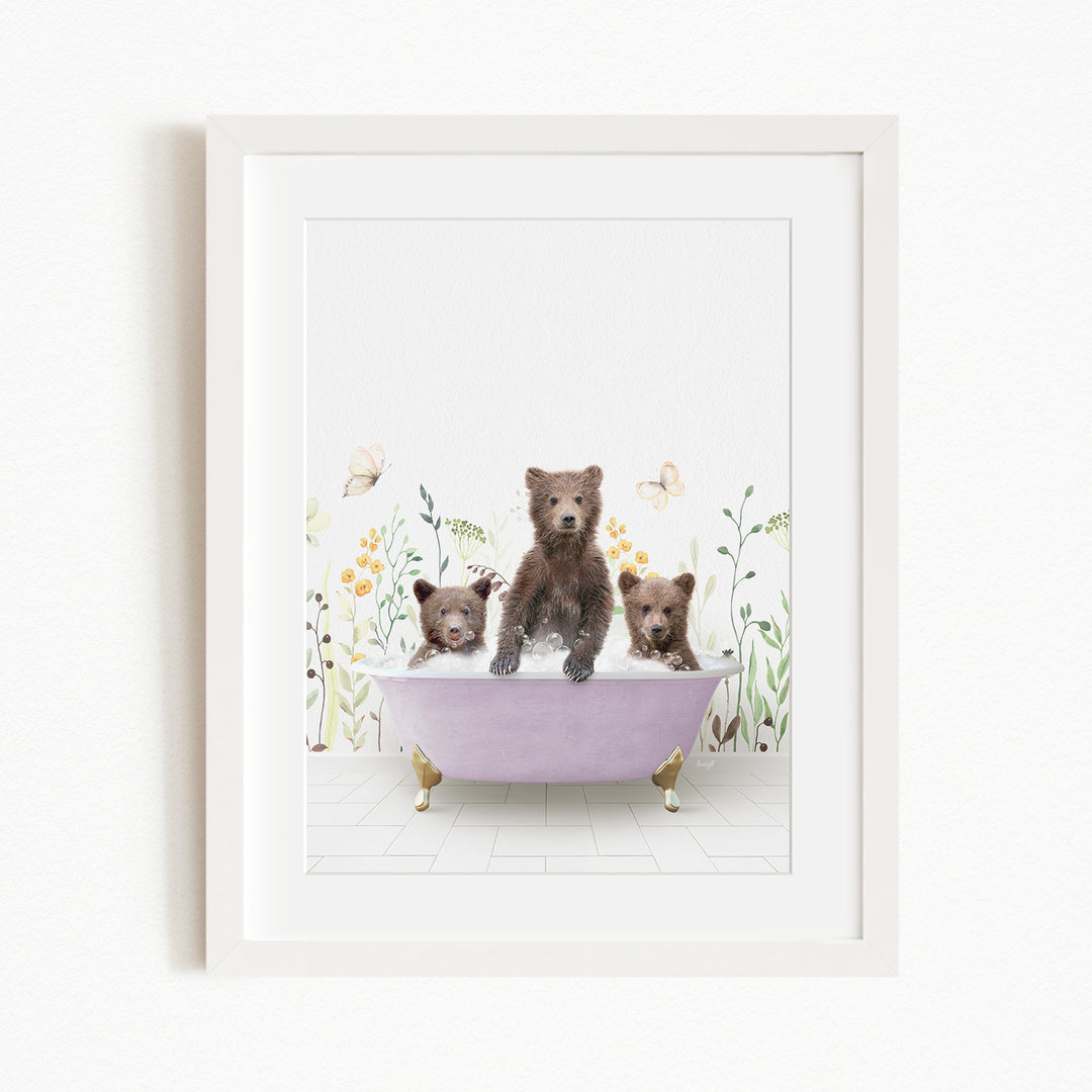 Three adorable brown bears sitting in a pink bathtub filled with bubbles, surrounded by flowers and butterflies.
