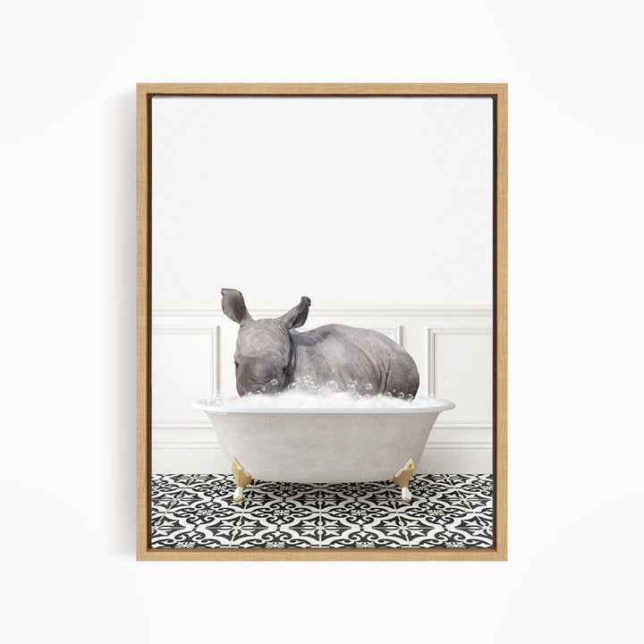 A rhinoceros is sitting in a bathtub filled with water, creating a whimsical and playful scene.