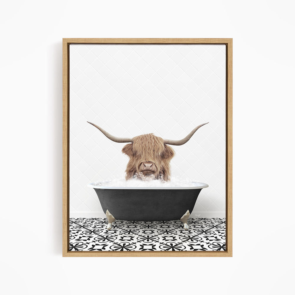 A Highland cow with long horns is sitting in a bathtub filled with water, creating a whimsical and playful scene.