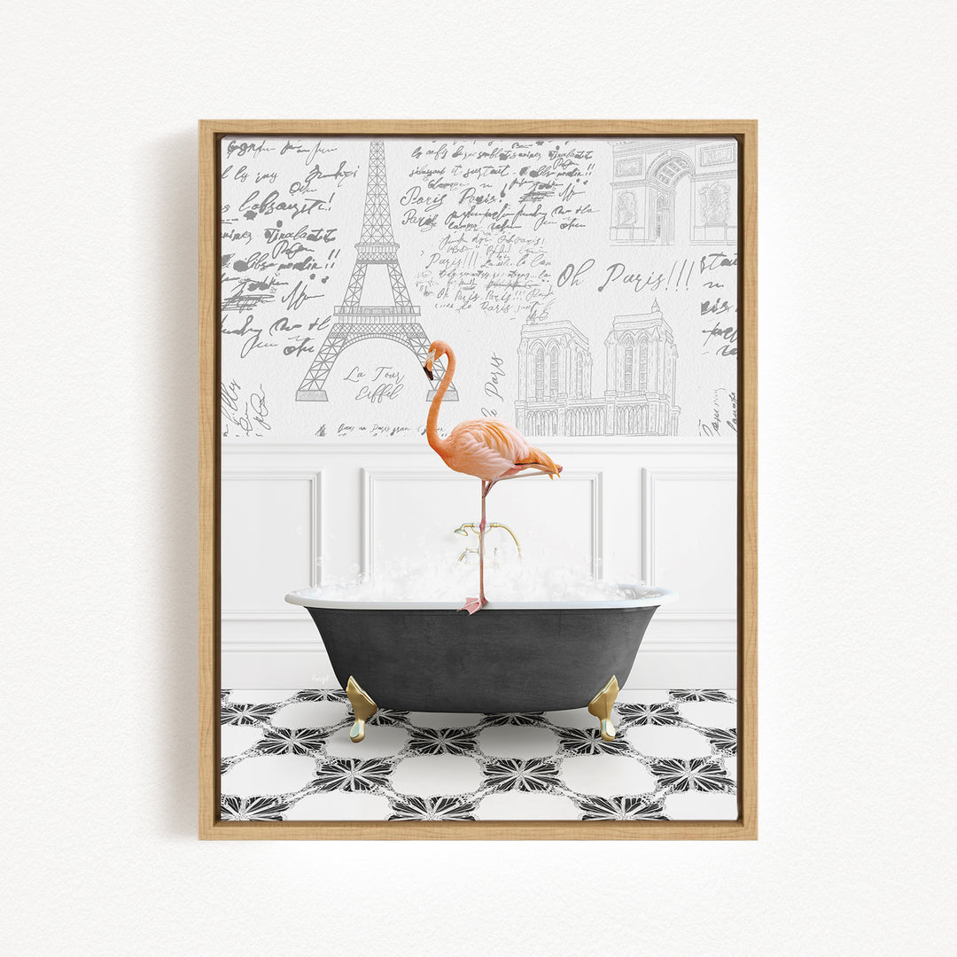 A framed image depicting a pink flamingo standing on a black bathtub filled with water, with a Paris-themed background featuring the Eiffel Tower and other Parisian architecture.