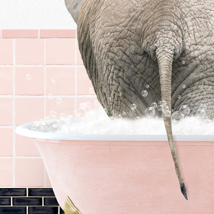 an elephant taking a bath in a pink bathtub