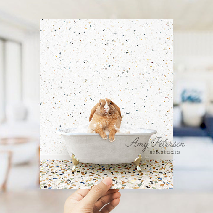 a person holding up a card with a picture of a rabbit in a bathtub