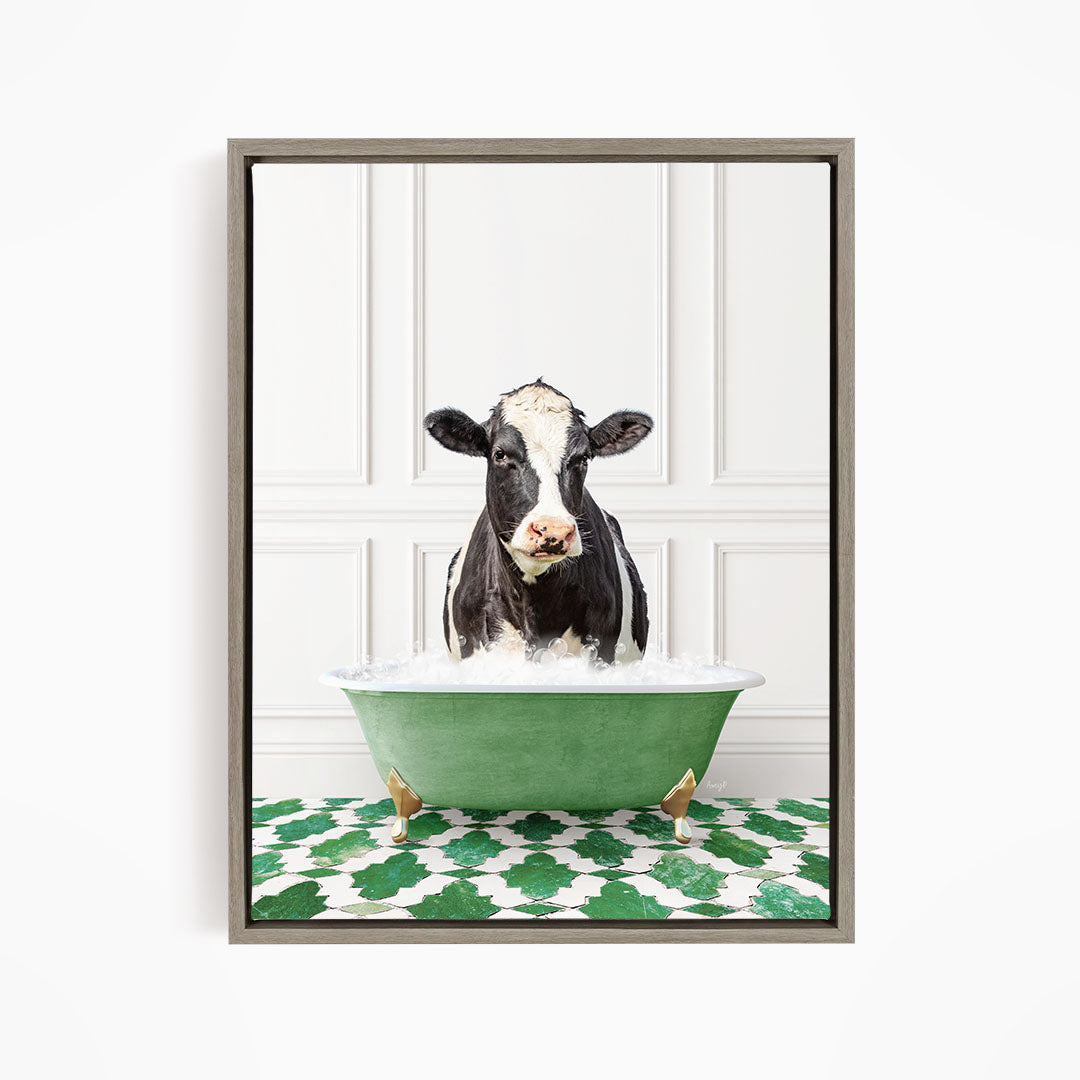 A black and white cow is standing in a green bathtub filled with water, creating a whimsical and humorous scene.