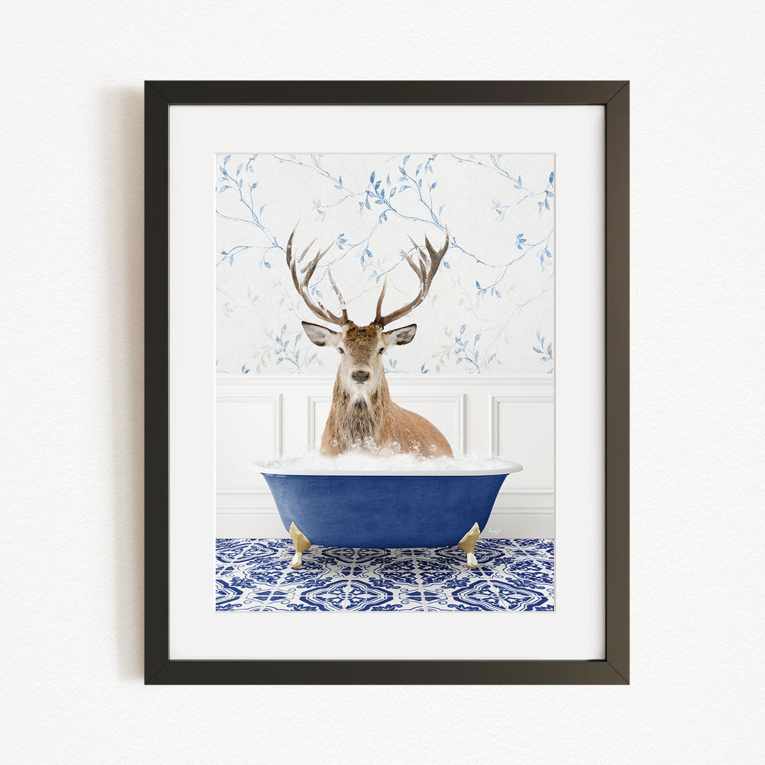 A deer with large antlers is sitting in a blue bathtub filled with water, surrounded by a patterned tile floor.