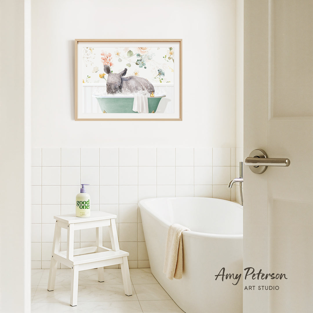 A bathroom interior with a white bathtub, a stool, and a framed painting of a rabbit in a bathtub on the wall.