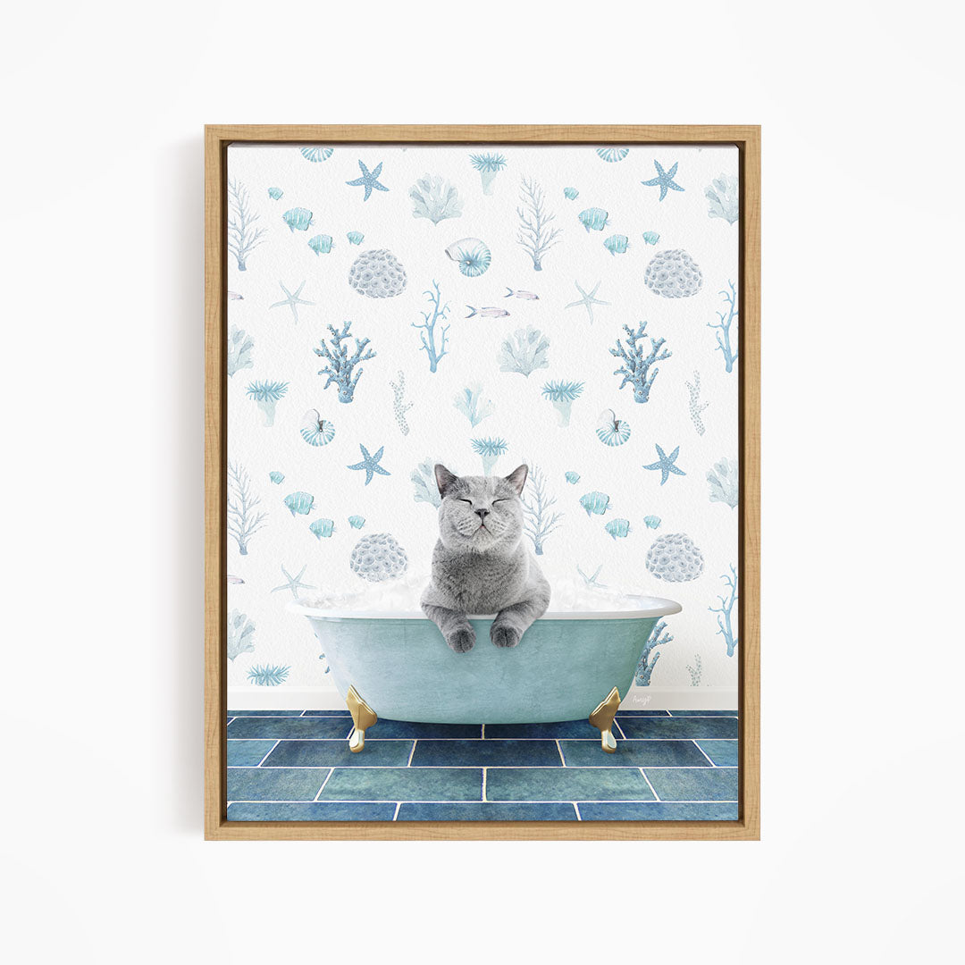 A gray cat sitting in a blue bathtub filled with water, surrounded by a pattern of seashells, starfish, and other marine life.