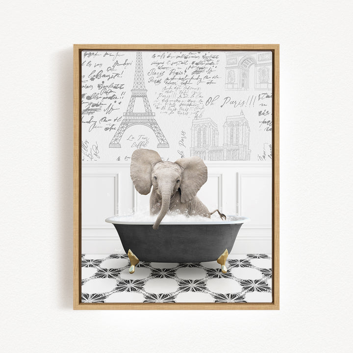 A gray elephant is sitting in a bathtub filled with water, surrounded by a black and white tiled floor and a wall with various inscriptions and drawings.