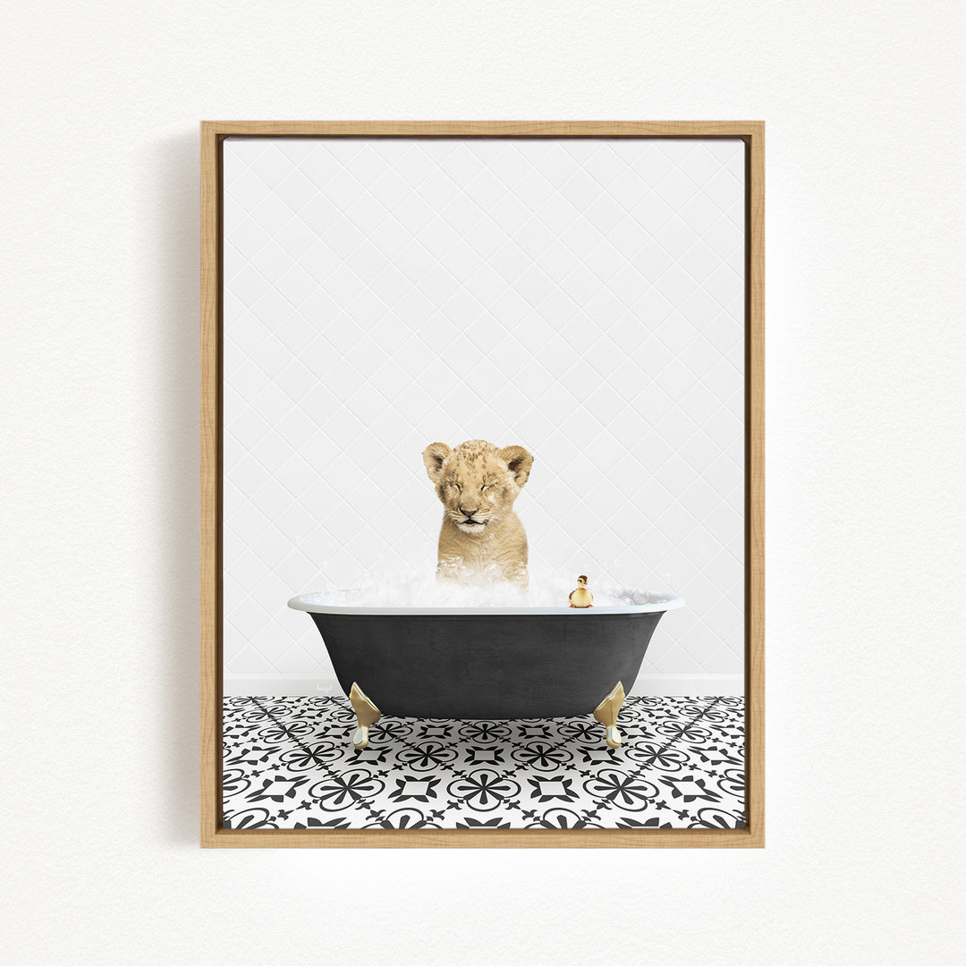 A young lion cub is sitting in a bathtub filled with water, surrounded by a black and white patterned floor.