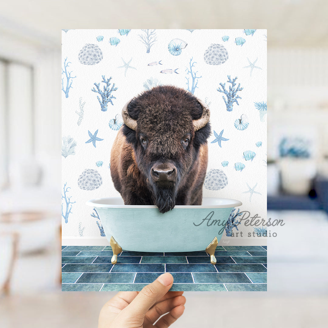 a hand holding up a card with a picture of a bison in a bathtub