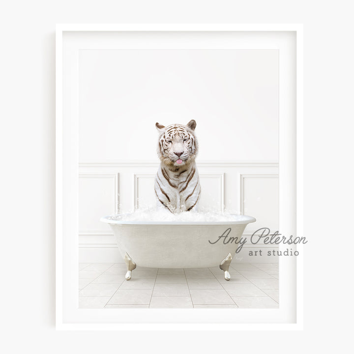 a white tiger is sitting in a bathtub